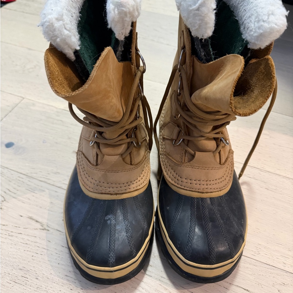 Tan and Black Sorel Caribou Boots with recycled felt lining with Sherpa cuff